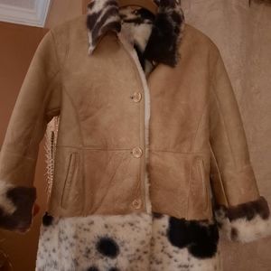 Gently worn girls leather shearling coat.